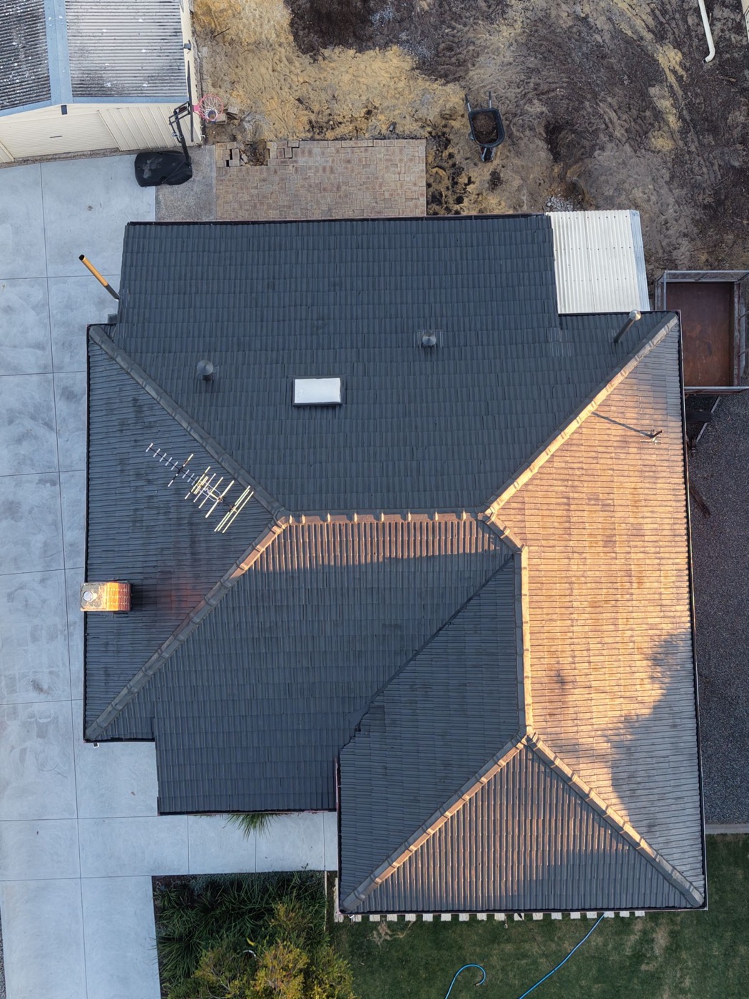 Roof after HydroFlow restoration, uniform charcoal finish