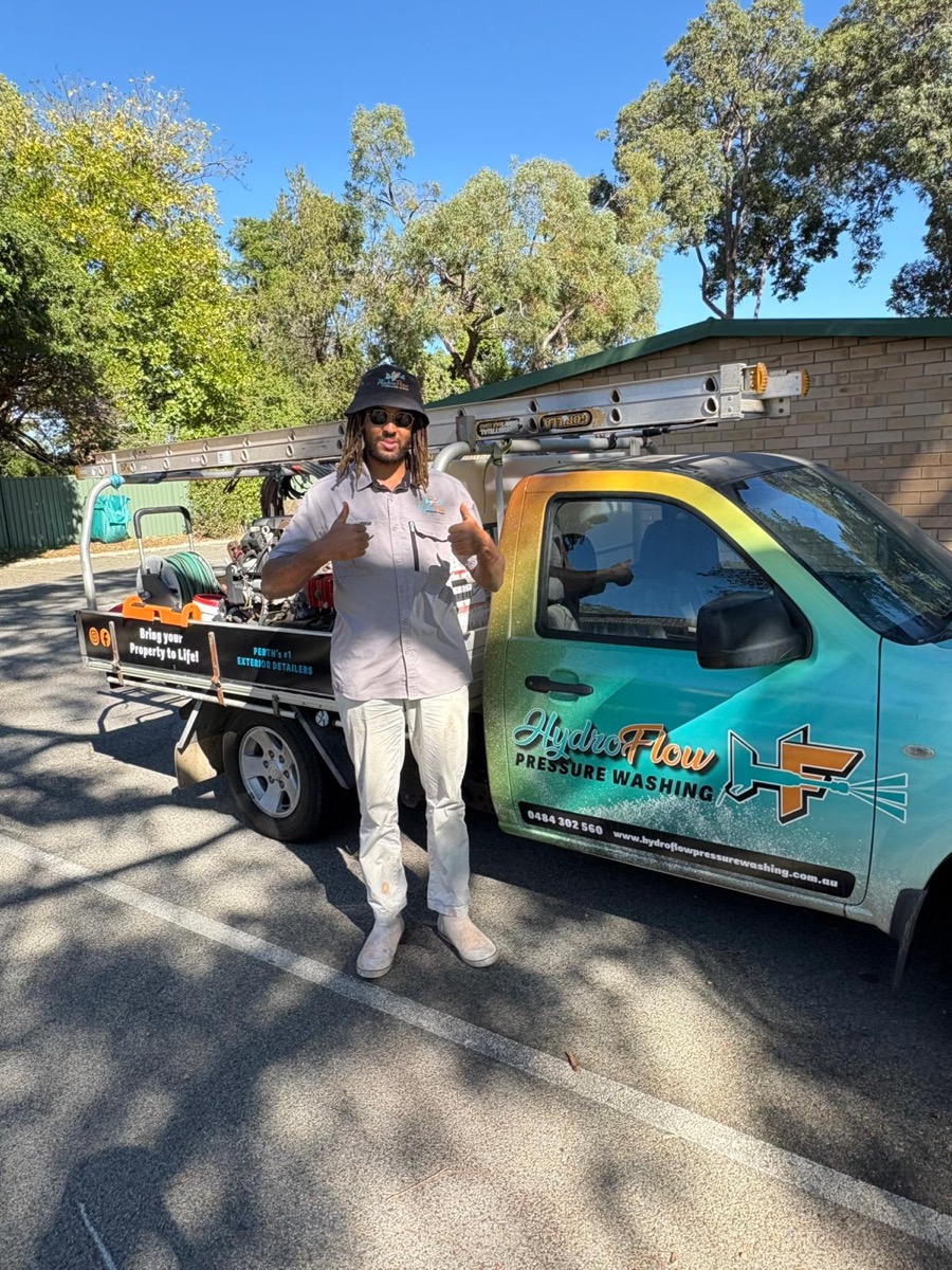 Stan, owner and operator of HydroFlow Pressure Washing, in front of his work truck